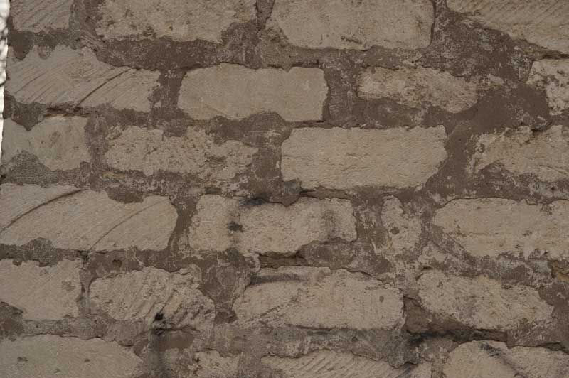 تصویر با کیفیت پس زمینه دیوار آجری کرمی