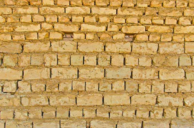 تصویر با کیفیت پس زمینه دیوار آجری کرمی